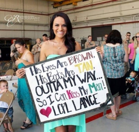 boots are tan kiss my man homecoming sign