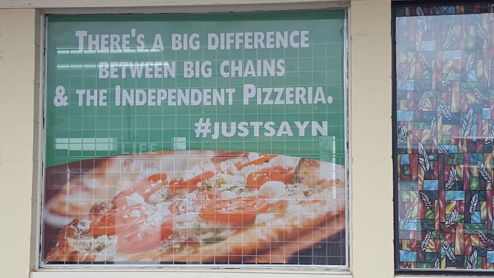 Decal that says "There's a big difference between big chains and the independent pizzeria."